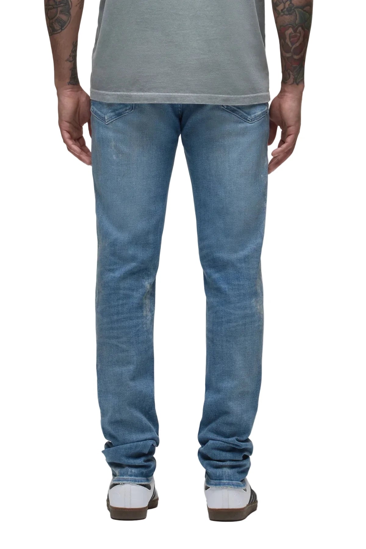 Hudson Zack Skinny Jeans in Ocean Ave medium indigo wash with distressing, pigment splatter details, and a modern skinny-fit silhouette.