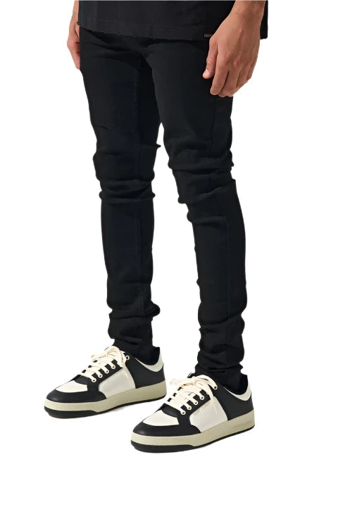  Jet black SERENEDE® VANTA 11 jeans with signature fitted cut, 4-way stretch fabric, embroidered logo, and leather waistband patch.