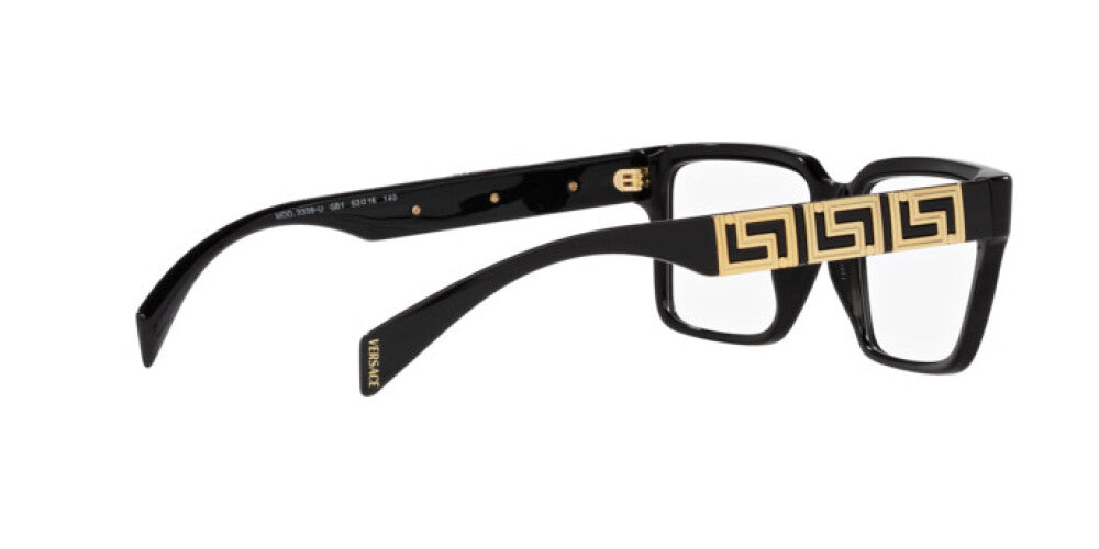 Black and gold eyeglasses on a white background