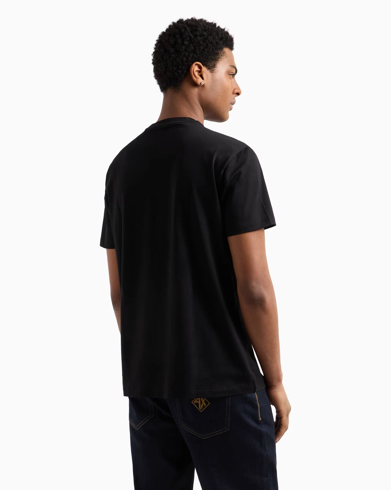 Person wearing a black t-shirt on a white background