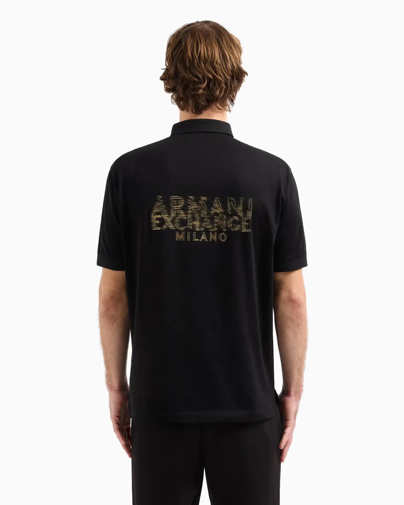 Person wearing a black Armani Exchange polo shirt with logo on the back, on a white background