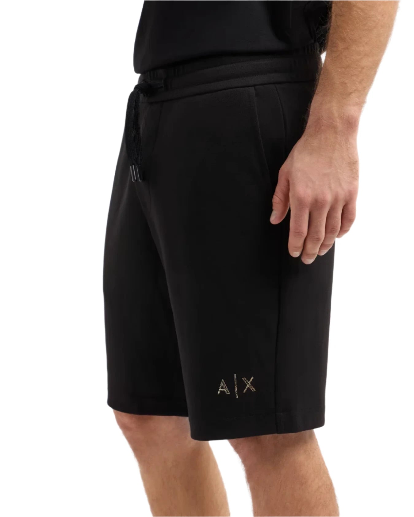 Black shorts with a brand logo on a white background