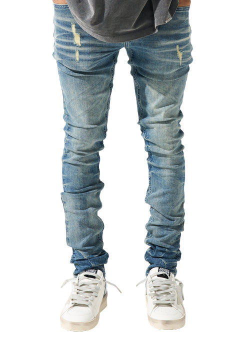 SERENEDE® Neptune Jeans in mid blue with fitted silhouette and branded hardware for streetwear style.