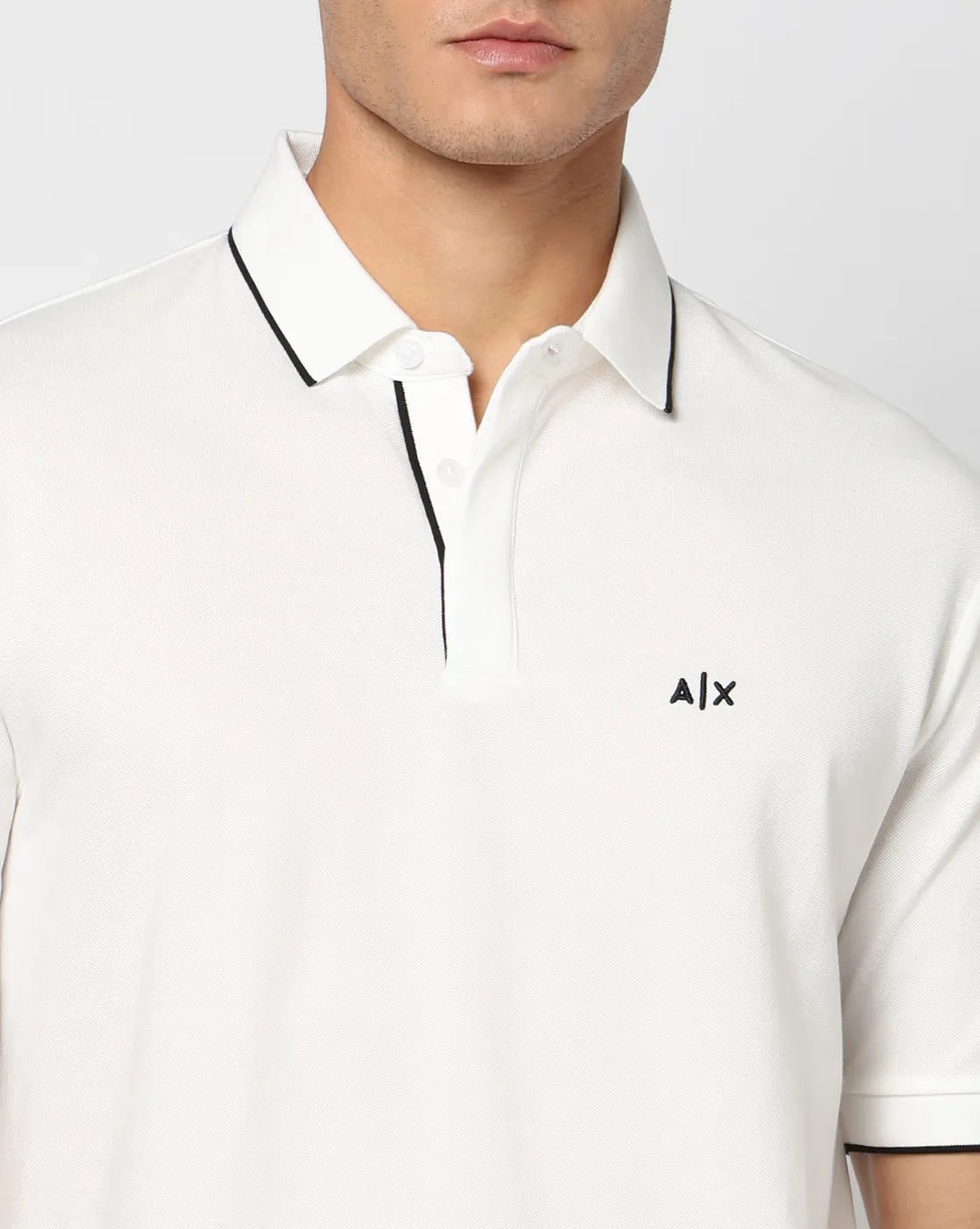 Armani Exchange Night Party regular fit polo shirt with cotton piqué fabric, contrast inserts, and signature AX chest logo.