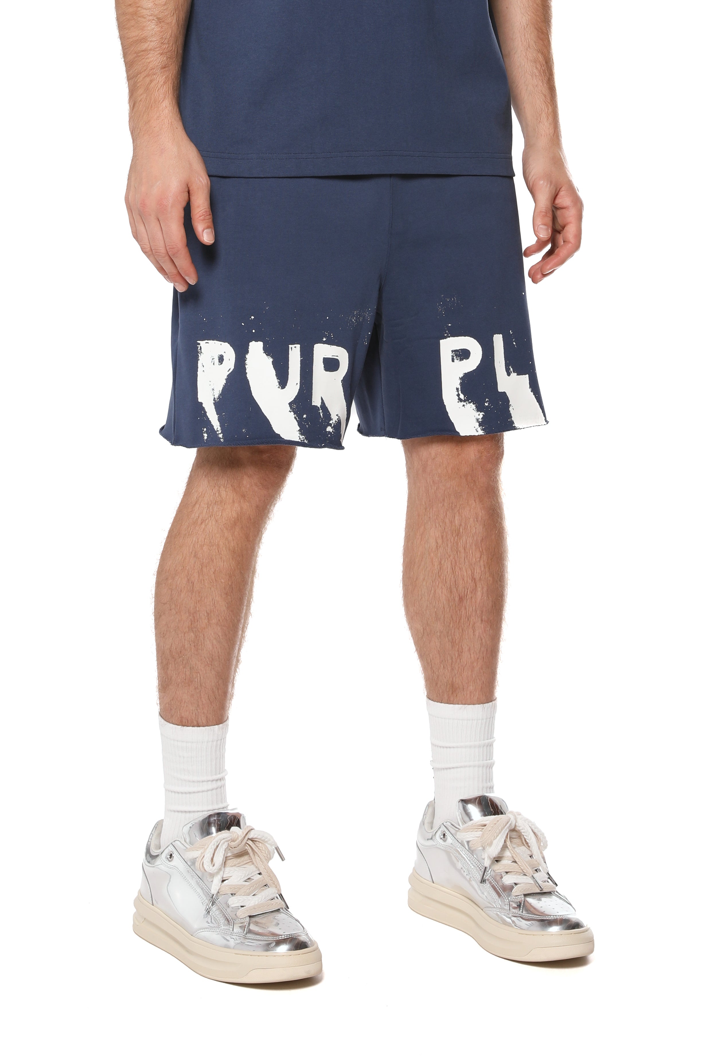 Purple Brand cotton sweat shorts featuring logo lettering on the front legs, a drawstring waistband, raw-edge hem, and two hand pockets.