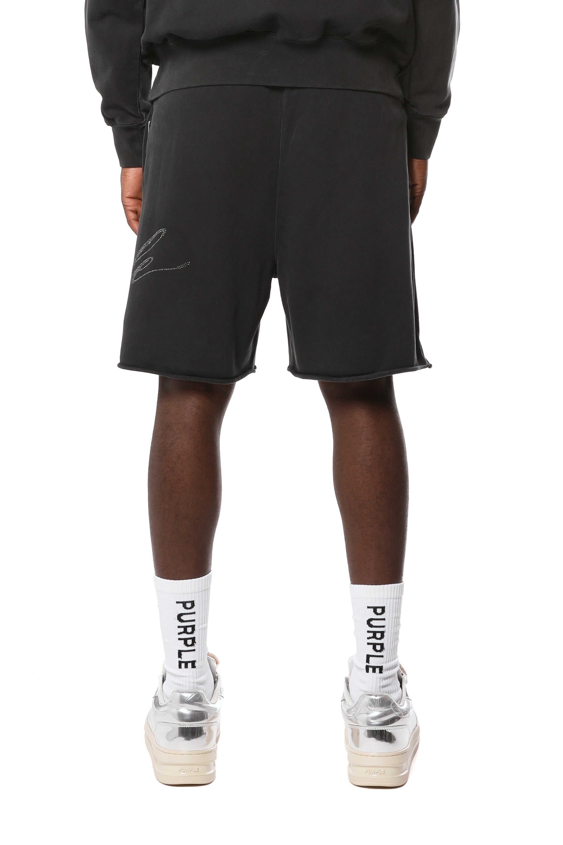 Purple Brand midweight cotton fleece shorts featuring an elasticized waistband, raw-edge hem, side slip pockets, and the signature logo at the hem.
