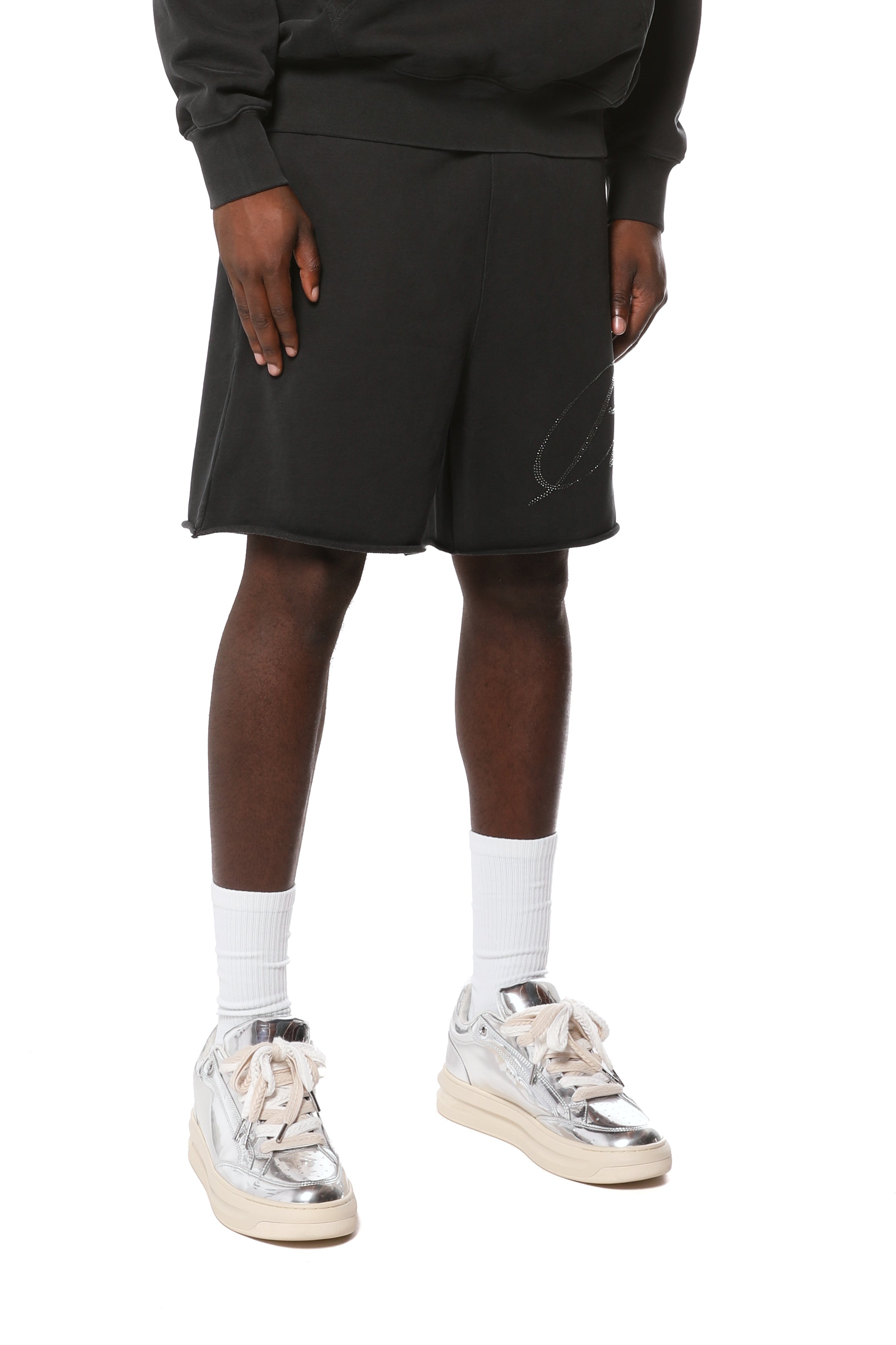 Purple Brand midweight cotton fleece shorts featuring an elasticized waistband, raw-edge hem, side slip pockets, and the signature logo at the hem.